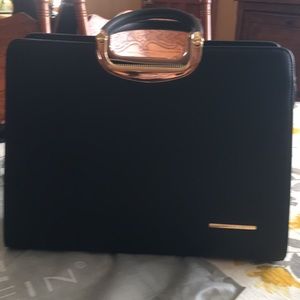 Black DASEIN handbag with clutch.